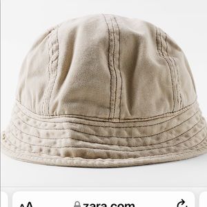 Bucket hat with tonal matching topstitching. item has special return conditions